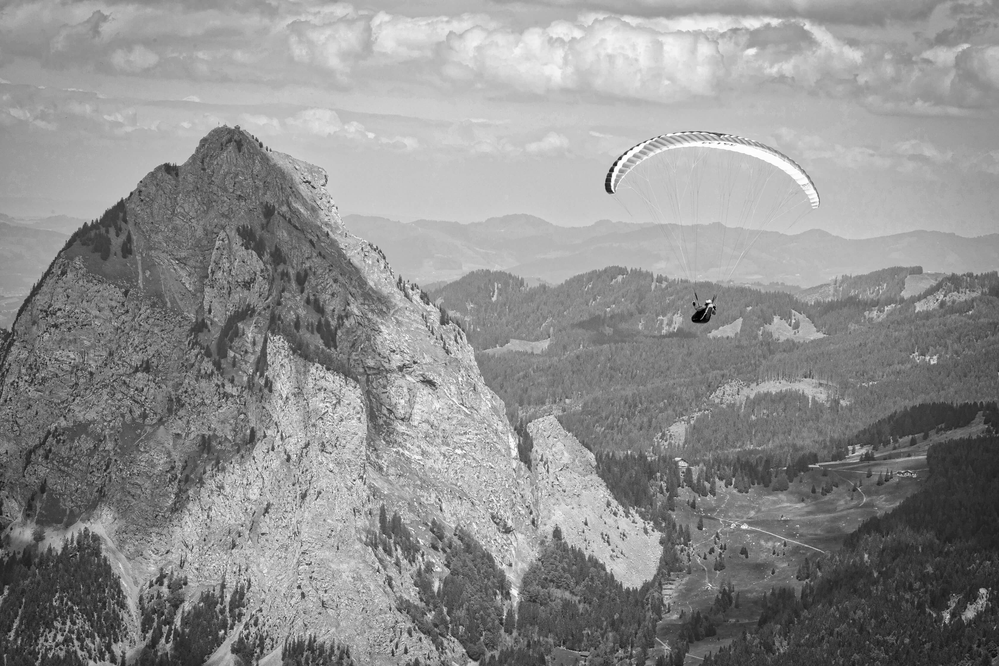 Paraglider having taken off from the top of the Fronalpstock mountain, switzerland