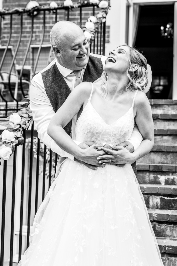 Wedding couple embrace at The Hove Club Sussex