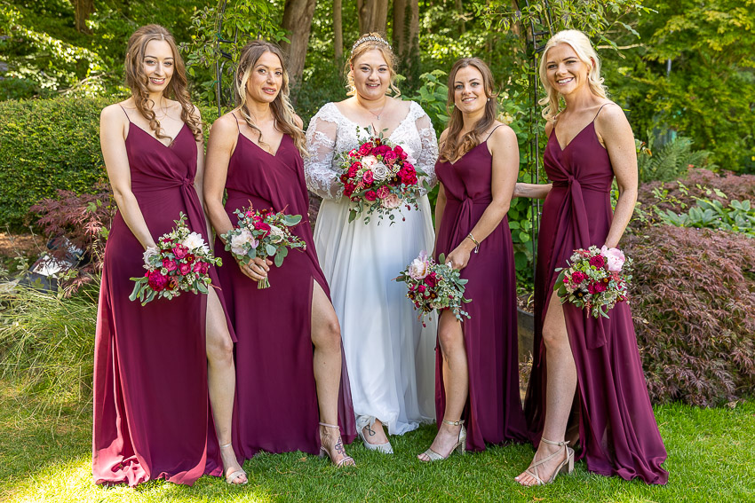 Bride and bridesmaids with flowers and legs